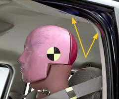 When the driver door opened, the dummy's head went outside the occupant compartment. The lap/shoulder belt prevented the dummy from being ejected