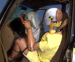 The dummy's position in relation to the steering wheel and instrument panel after the crash test indicates the driver's survival space was maintained reasonably well