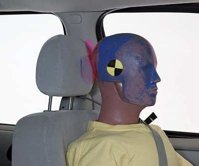 Smeared pink greasepaint indicates where the dummy's head hit the B-pillar. Head acceleration from this hit was low