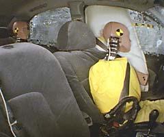 Action shot taken during the side impact crash test showing the driver dummy's head was protected from being hit by hard structures by the side airbag