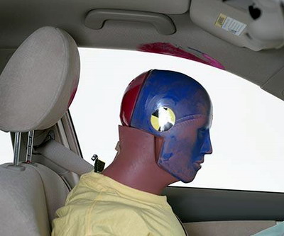 Smeared greasepaint indicates where the dummy's head hit the roof rail during rebound. Head acceleration from this hit was low