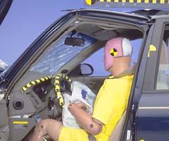 Buckling of the roof rail and rearward movement of the instrument panel indicate the driver's survival space wasn't maintained well