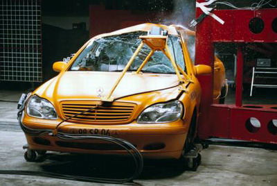 The W220 S-Class is crashed against a steel beam, frontal view
