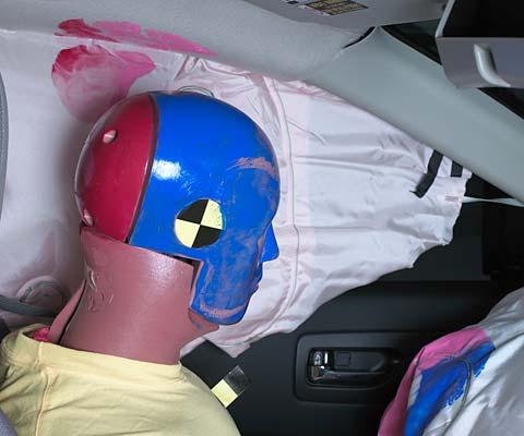 Smeared greasepaint indicates where the dummy's head contacted the side curtain airbag and dislodged headliner during rebound