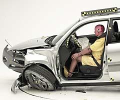 The dummy's position in relation to the steering wheel and instrument panel after the crash test indicates that the driver's survival space was maintained well