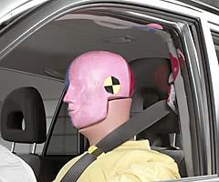 Smeared greasepaint indicates where the dummy's head hit the B-pillar and roof rail during rebound. Head accelerations from these hits were low