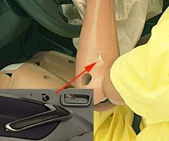 Smeared greasepaint indicates where the dummy's head hit the B-pillar and roof rail during rebound. Head accelerations from these hits were low