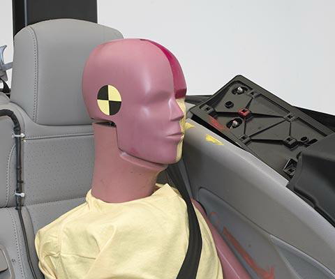 Smeared yellow and red greasepaint shows where the rear passenger dummys head was hit by the interior side trim